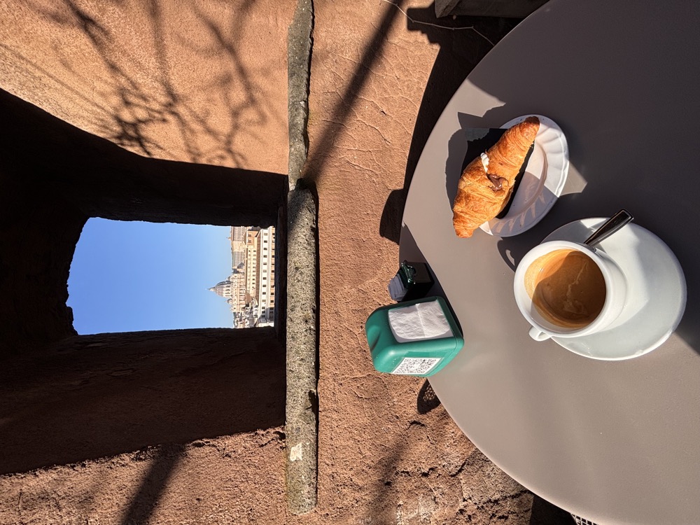 Coffee and croissant on an Italian terrace
